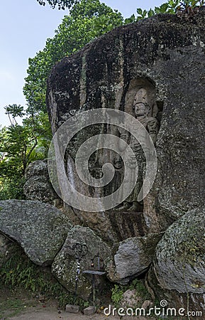 Ancient holy carved sculpture Rock of the Leper King Stock Photo