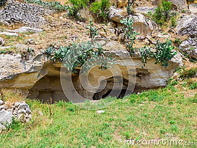 Ancient houses carved in the rock in Ginosa, Italy Stock Photo