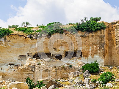 Ancient houses carved in the rock in Ginosa, Italy Stock Photo