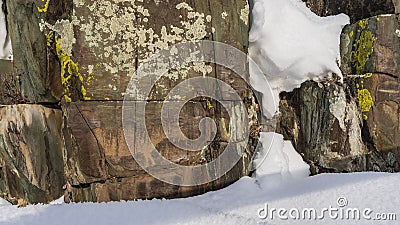 Ancient huge boulders covered with yellow and white lichens. Stock Photo