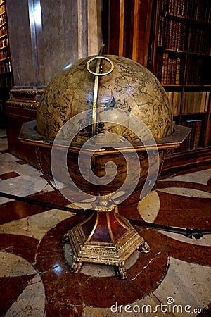 Ancient huge globe standing in the main hall of the National Austrian Library in the Hofburg Palace Editorial Stock Photo
