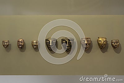 Ancient indigenous small golden faces at golden museum Editorial Stock Photo