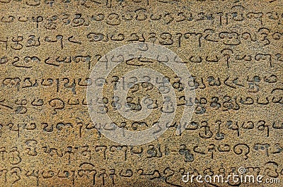 Ancient inscriptions on stone wall Stock Photo