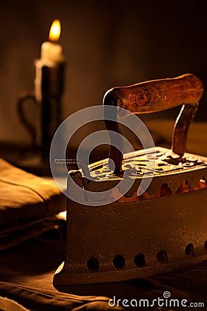 Ancient Iron with Candle Stock Photo