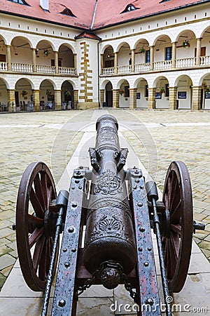 Ancient iron cannon at the royal castle in Niepolomice, Poland. Editorial Stock Photo
