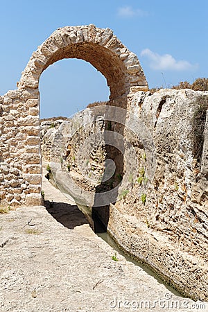 Ancient irrigation ditch and arch in archeological park in Israel Stock Photo