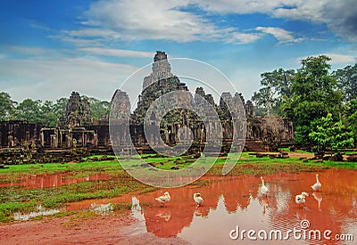 Ancient Khmer architecture. Ta Prohm temple with giant banyan tree at sunset. Angkor Wat complex, Siem Reap, Cambodia travel desti Stock Photo