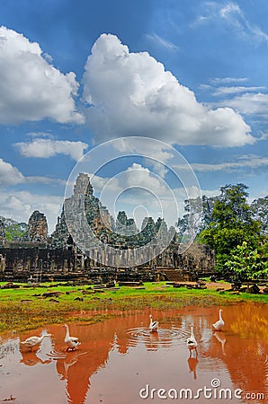 Ancient Khmer architecture. Ta Prohm temple with giant banyan tree at sunset. Angkor Wat complex, Siem Reap, Cambodia travel desti Stock Photo