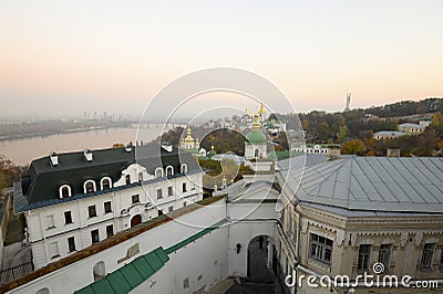 Ancient Kiev-Pechersk Lavra and beautiful evening Dnieper river in a pink haze Stock Photo