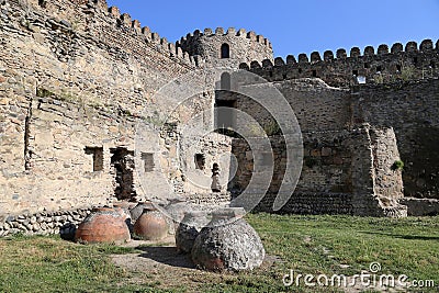 Ancient Kvevri - clay vessels for making wine, buried in the ground under the fortress wall near the Svetitskhoveli Cathedral Stock Photo