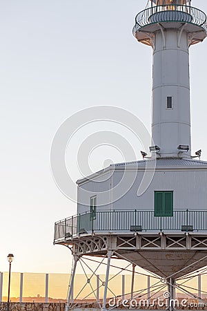 Ancient lighthouse, Far de la Banya in port of Tarragona,Spain. Stock Photo