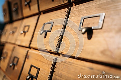 Ancient and lined massive wood file cabinets Stock Photo