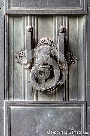 Ancient lion head door knocker Stock Photo