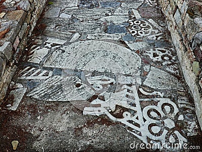 Ancient Marble Bas Relief Sculptures on Path, Greece Stock Photo