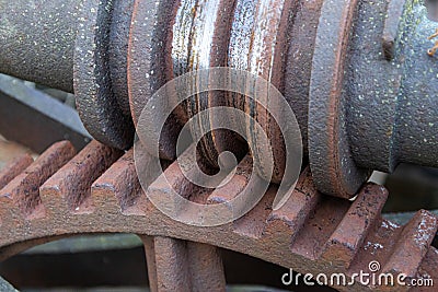Ancient, massive, abandoned, rusting worm drive gear box showing wear Stock Photo