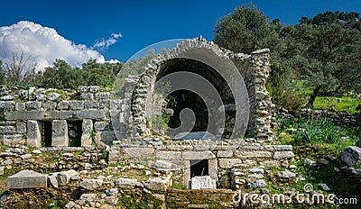 Ancient Mausoleum detail from Euromos Ancient City Ruins. Milas, Aydin, Turkey. South Necropolis. Old ruined arches. Stock Photo