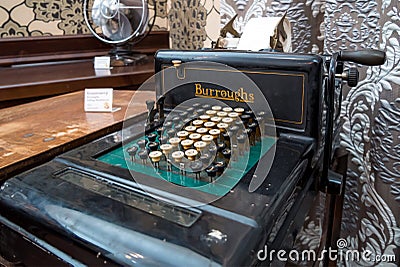 The ancient mechanical calculator `Burroughs Adding Machine CO` Editorial Stock Photo
