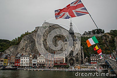 The ancient medieval city of Dinan, where the saxophone was coined. View of houses from the river and flags of different countries Editorial Stock Photo