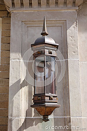 Ancient Medieval Style Bronze Wall Lantern Light with Sharp Spike on Top Stock Photo
