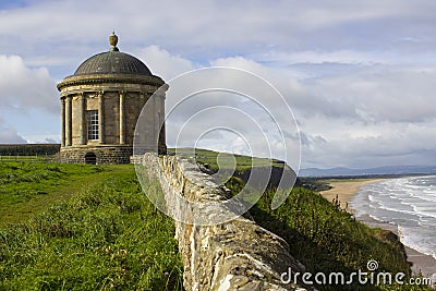 The ancient Mussenden Temple Monument on the clifftop edge overlooking Downhill Beach in County Londonderry Northern Ireland Stock Photo