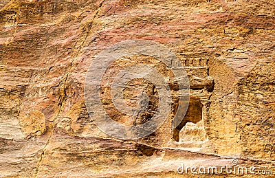 Ancient Nabataean Rock Carvings at the Siq in Petra Stock Photo