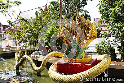 Ancient naka or naga Himmapan animal creature of Himavanta legendary forest in garden of ubosot ordination hall for thai people Stock Photo