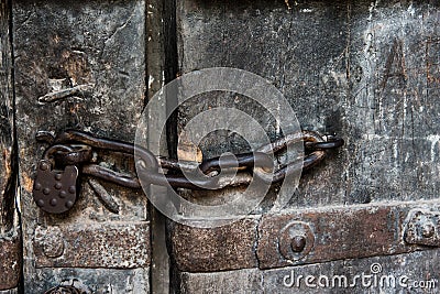 Ancient old chain with lock concept on old door, wallpaper, background Stock Photo