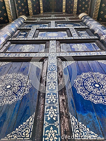 Ancient ornate temple door, buddhist art, thailand Stock Photo