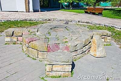 Ancient pagan temple or place of sacrifice, made of stone, in the shape of a Celtic cross or cross placed in a circle Stock Photo