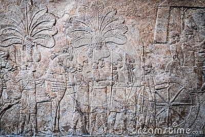 Ancient persian bas-relief depicting a marching army Stock Photo