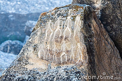 Ancient petroglyph depicting humans in Gobustan, Azerbaijan Stock Photo