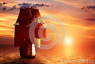 Ancient pirate ship sailing on the ocean at sunset Stock Photo