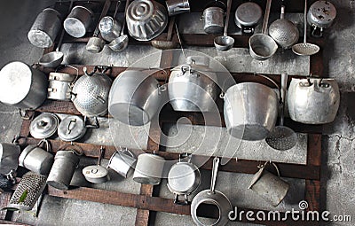 Ancient pots in iron Hung on the wall Stock Photo