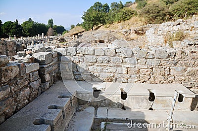 Ancient public toilet at Ephesus, Turkey Stock Photo