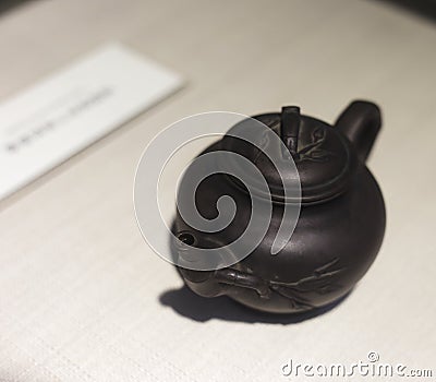 Ancient purple clay teapot Stock Photo