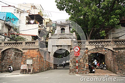 Ancient Quan Chuong Gate in old Hanoi street Editorial Stock Photo