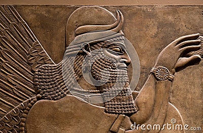 Ancient relief of an assyrian god Stock Photo