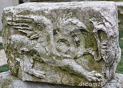 Ancient relief with winged Griffin, or Gryphon on funerary stele from Byzantine cemetry beside ancient church of the Holy Apostles Stock Photo