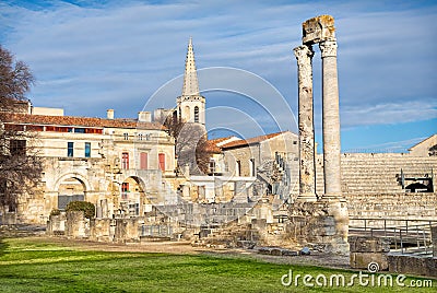 Ancient roman columns and amphitheatre in Arles Stock Photo