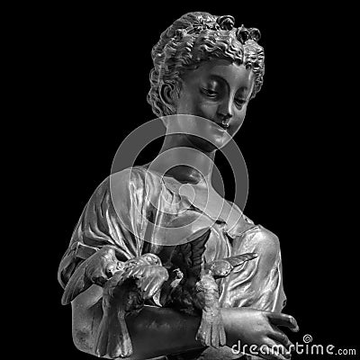 Ancient Roman or Greek neoclassical statue of young woman isolated on black background. Female sculpture Stock Photo