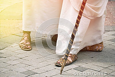 Ancient Roman people in vintage clothes and caligae leather sandals. Reconstruction of the events of the Roman Empire Stock Photo