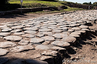 Ancient Roman road paved with stones for carriage. Decumano maxi Stock Photo