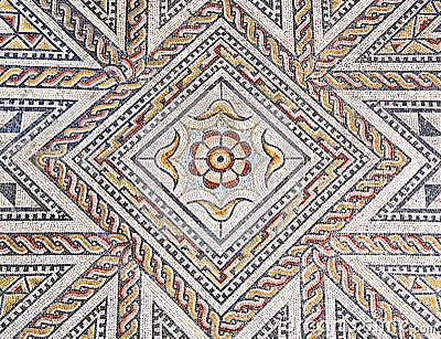 Ancient roman stone mosaic floor with geometric design Stock Photo