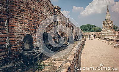 Ancient ruin of sitting buddha statue at old royal temple. Editorial Stock Photo