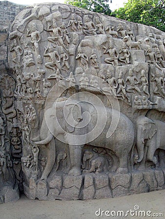 Ancient ruins art in Angkor Thom, Cambodia with image of elephant and people carved into stone wall Stock Photo