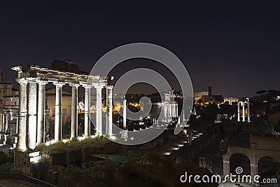 Ancient ruins at forum romanum in Rome at night Stock Photo