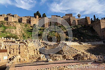 Ancient ruins of the Roman Theatre next to the famous fortress of the Alcazaba, Malaga Editorial Stock Photo