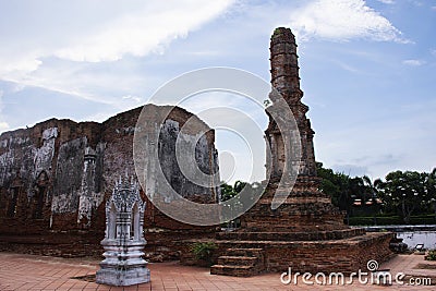 Ancient ruins ubosot ordination hall and antique old ruin stupa chedi for thai people visit respect praying blessing at Wat Yai Stock Photo