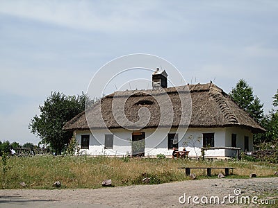 Ancient rustic shack on a field Stock Photo