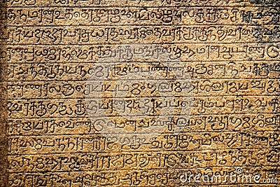 Ancient sanskrit on sandstone tablet Stock Photo